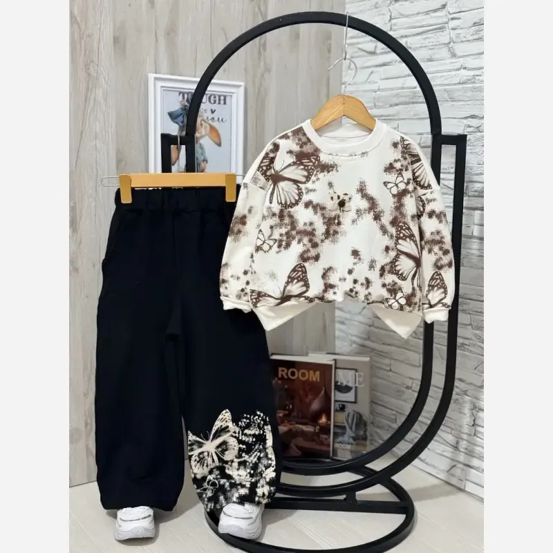 ست بلوز و شلوار دخترانه طرح پروانه جنس دورس لاکرا رنگ کرم سفید شکلاتی سایز 45 تا 65 - تصویر 9