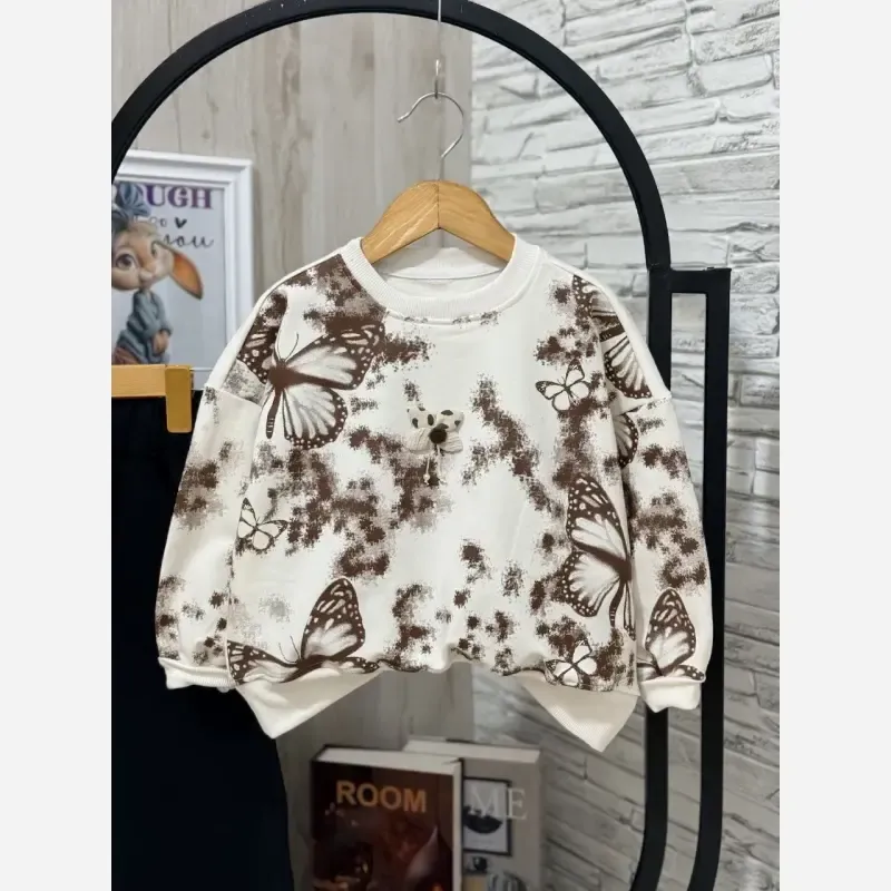ست بلوز و شلوار دخترانه طرح پروانه جنس دورس لاکرا رنگ کرم سفید شکلاتی سایز 45 تا 65 - تصویر 5