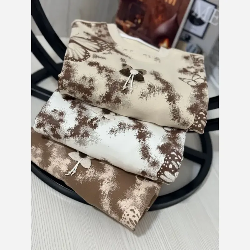 ست بلوز و شلوار دخترانه طرح پروانه جنس دورس لاکرا رنگ کرم سفید شکلاتی سایز 45 تا 65 - تصویر 7